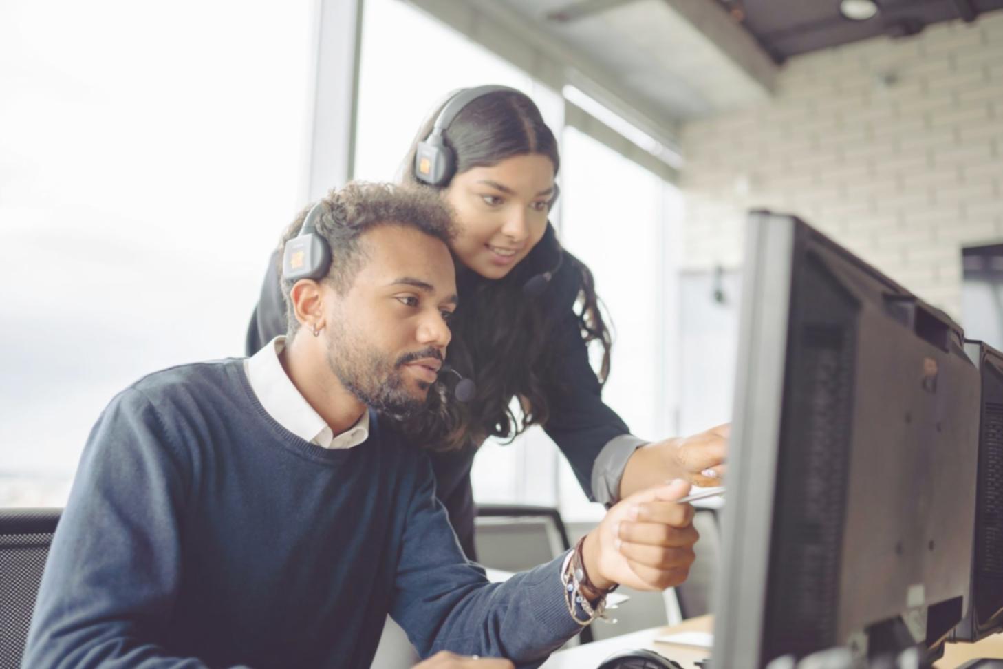 Students working on blockchain code in a modern classroom setting